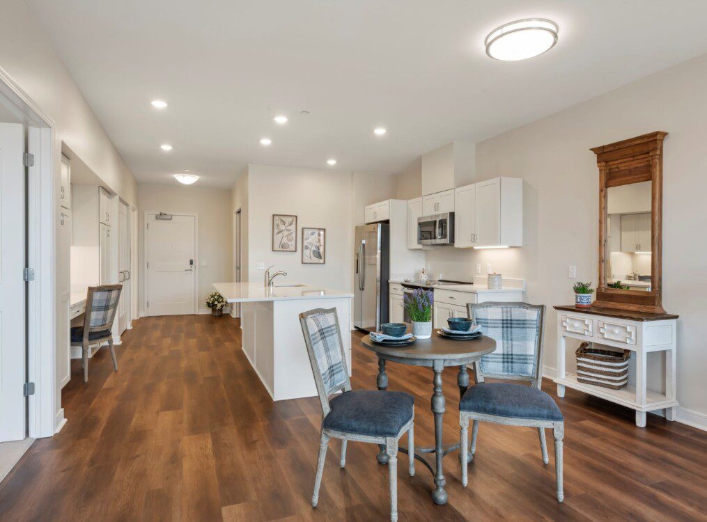 interior of apartment kitchen table and chairs with kitchen in background